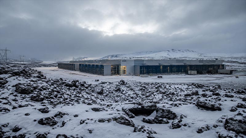 Modern data center in Iceland with snowy mountains